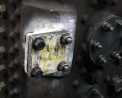 . . . while this one covers the repaired manifold flange. Other mountings on the backplate have also been blanked off, as with that to the right.