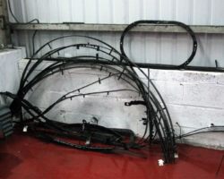 With the holes retapped, the examination over and with the necessary repairs noted, the parts were stored against the wall, ready to answer the call. The large oval piece surrounds the safety valves.