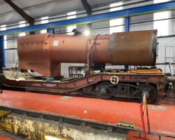The boiler on its bolster wagon inside the loco shed awaiting our attention.