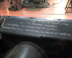 Work requirements chalked on the ashpan, to be ticked off on completion.