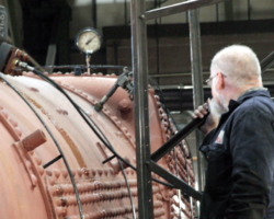 Phil, the boiler shop foreman, watches the gauge rise.