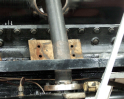 The left side stream pipe bolted to the top of the steam chest.