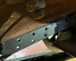 The new ash pan will fit using nuts and bolts to the lap joint pictured.